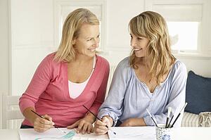 Mid age women painting with watercolors