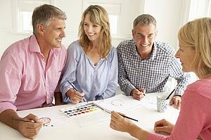 Mid age couples painting with watercolors
