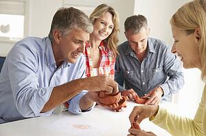 Mid age couples clay modelling