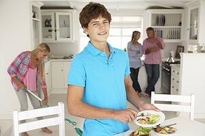 Teenagers helping with housework