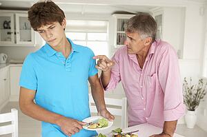 Father making teenage son do housework