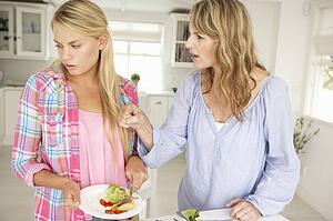 Mother and teenage daughter arguing about housework