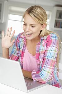 Teenage girl using laptop
