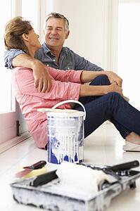 Senior couple decorating house