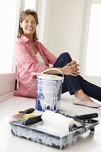 Senior woman decorating house