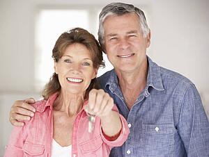 Senior couple moving into new home
