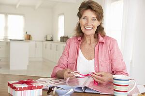Senior woman scrapbooking
