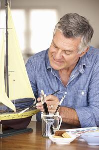 Senior man model making