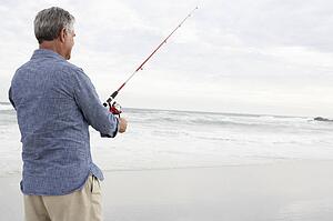 Senior man fishing in sea