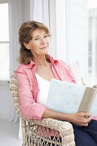 Senior woman with photo album