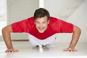 Man doing push-ups in home gym