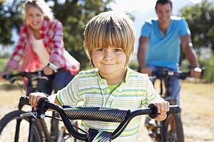 Young family on country bike ride
