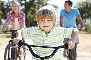 Young family on country bike ride