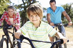 Young family on country bike ride