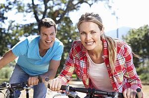 Young couple on country bike ride