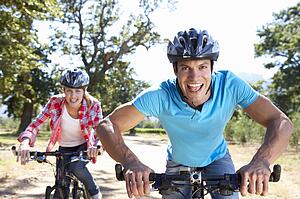 Young couple on country bike ride