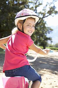 Little girl on country bike ride