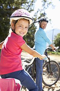 Little girl on country bike ride with grandma
