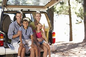 Young family on day out in country