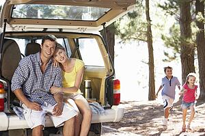 Young family on day out in country