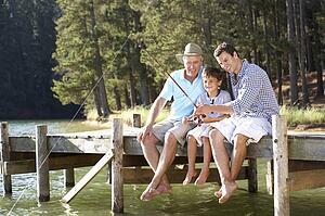 Father, son and grandson fishing together