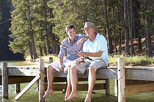 Father and adult son fishing together
