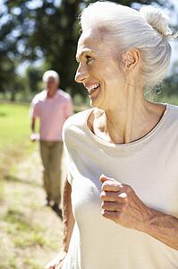 Senior couple on country run