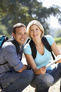 Couple with map on country walk