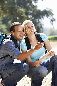 Couple with map on country walk