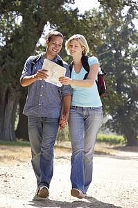 Couple with map on country walk