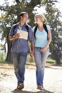 Couple with map on country walk