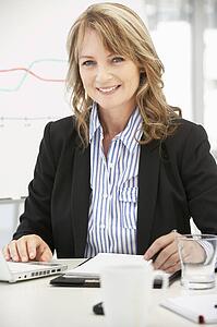 Mid age businesswoman at work
