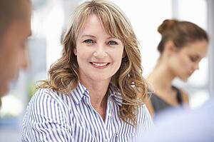 Mid age businesswoman in meeting