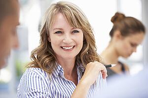 Mid age businesswoman in meeting
