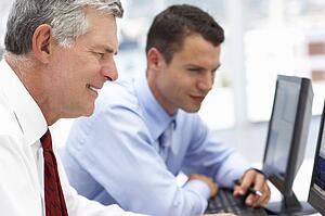 Businessmen working on computers