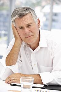 Unhappy senior businessman