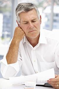 Unhappy senior businessman
