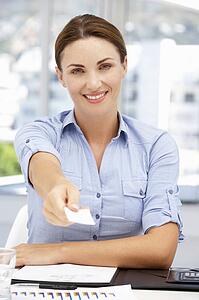 Businesswoman offering business card