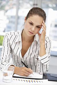 Thoughtful young businesswoman