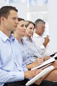 Group watching business presentation