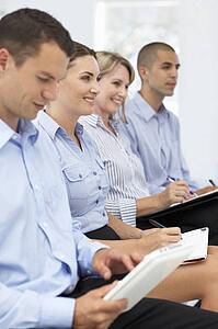Group watching business presentation