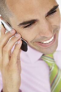 Young businessman using cellphone