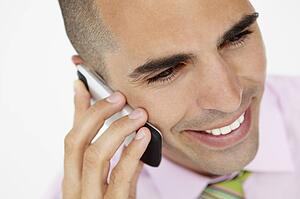 Young businessman using cellphone