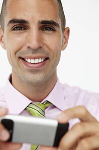 Young businessman using cellphone