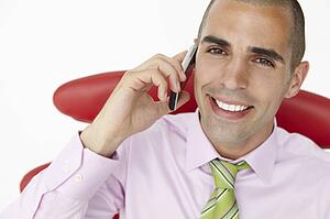 Young businessman using cellphone