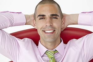 Young businessman relaxing in chair