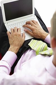 Young businessman using laptop
