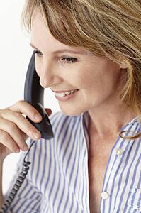 Mid age businesswoman on phone