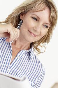 Mid age businesswoman at work