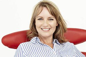 Mid age businesswoman relaxing in chair